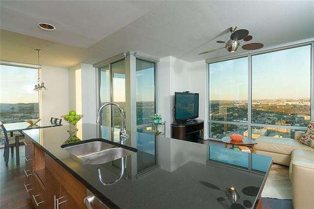 Floor to Ceiling windows throughout condo with pan