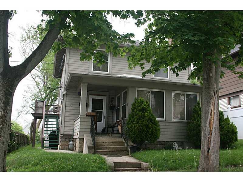Exterior Front. Four Square Home with lovely woodw