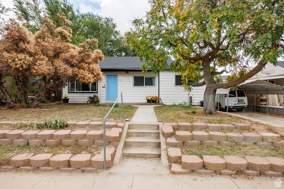 View of front of home with a carport