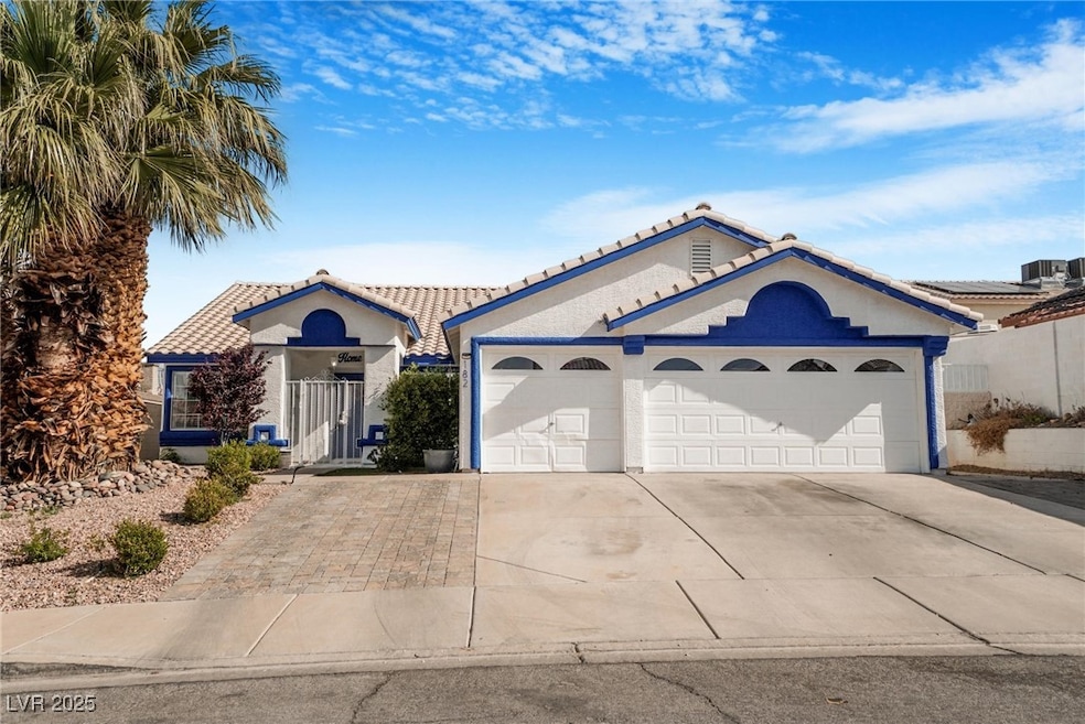 View of front of house featuring a tile roof, an a