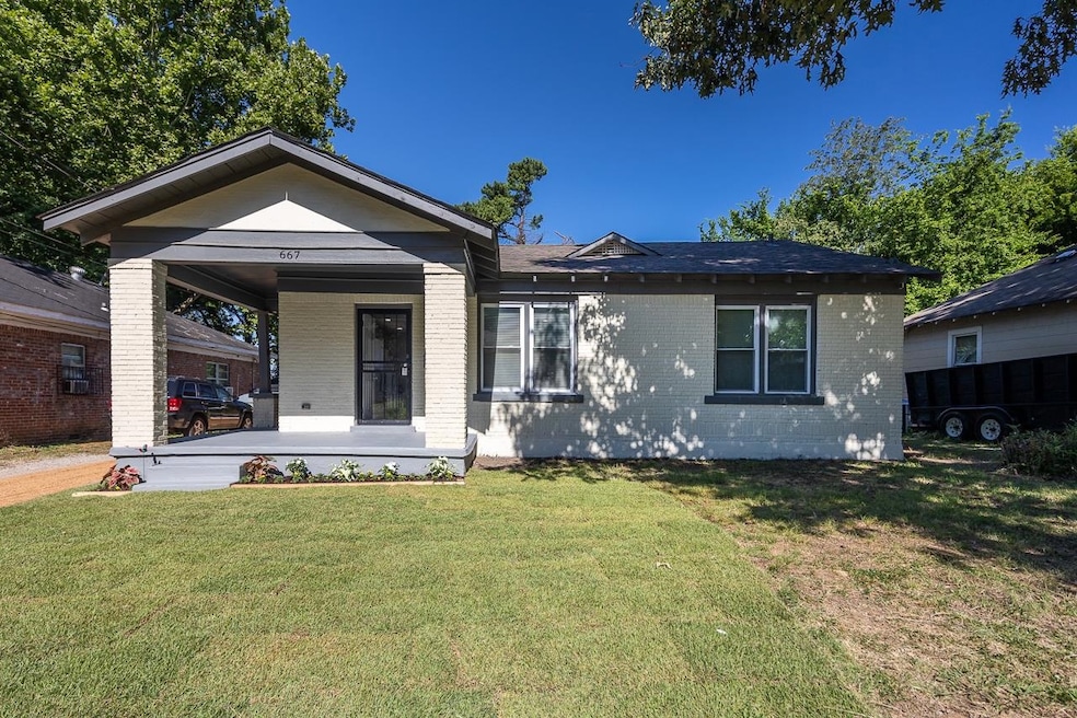 View of front of property with a front lawn