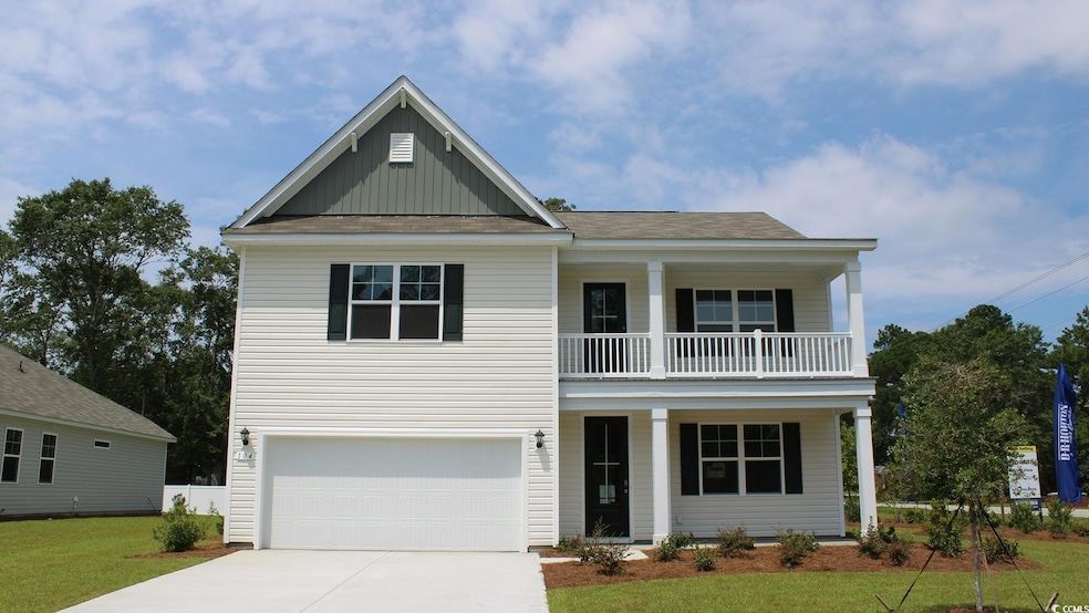 View of front facade with an attached garage, conc