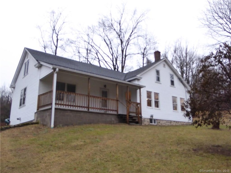 Beautiful front porch and new vinyl siding.