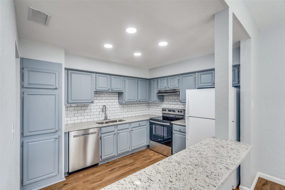 Kitchen featuring LED lighting with a small eating