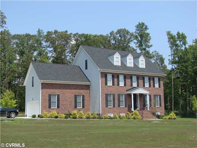Exterior Front - Brick front with vinyl siding