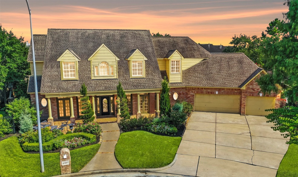 Stunning custom built home on a wooded cul-de-sac lot with a sparkling heated pool & spa features a brick exterior with dormer windows and keystone accents, professional landscaping including stone-lined flower beds and an automatic sprinkler system. This gorgeous home features a private study, formals, a custom gourmet kitchen, family, game & media rooms.