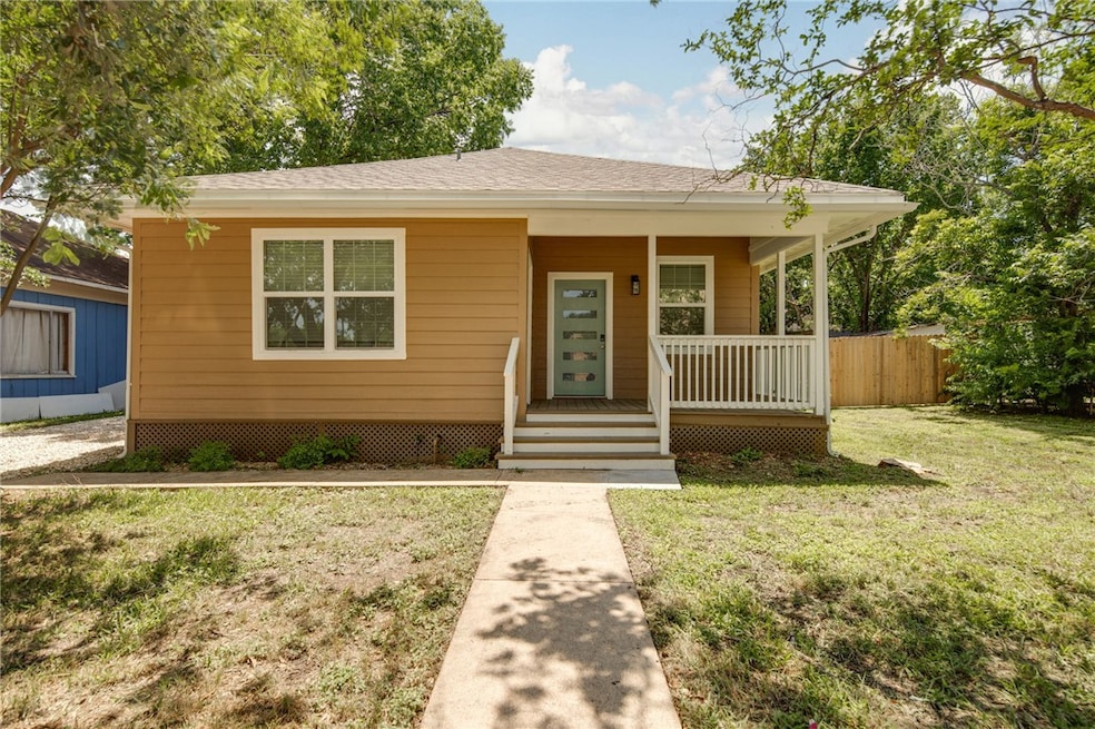 Bungalow-style home with a porch and a shingled ro