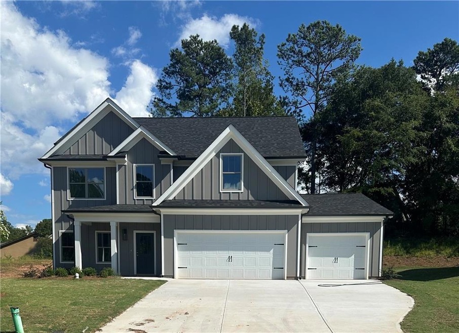 Craftsman-style house featuring a garage and a fro