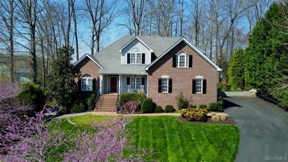 View of property with a front yard
