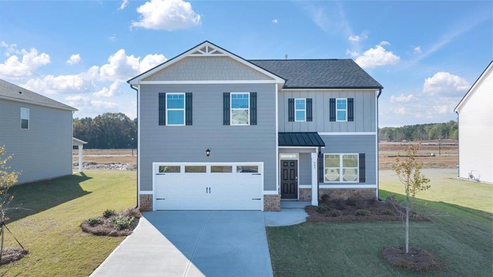 Craftsman-style house with a garage and a front la