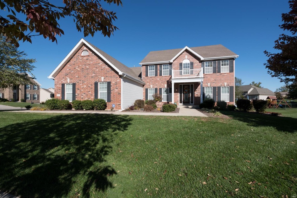 Beautiful brick front elevation on a nearly 1/2 acre lot on a private street at the edge of Busch Wildlife Conservation!