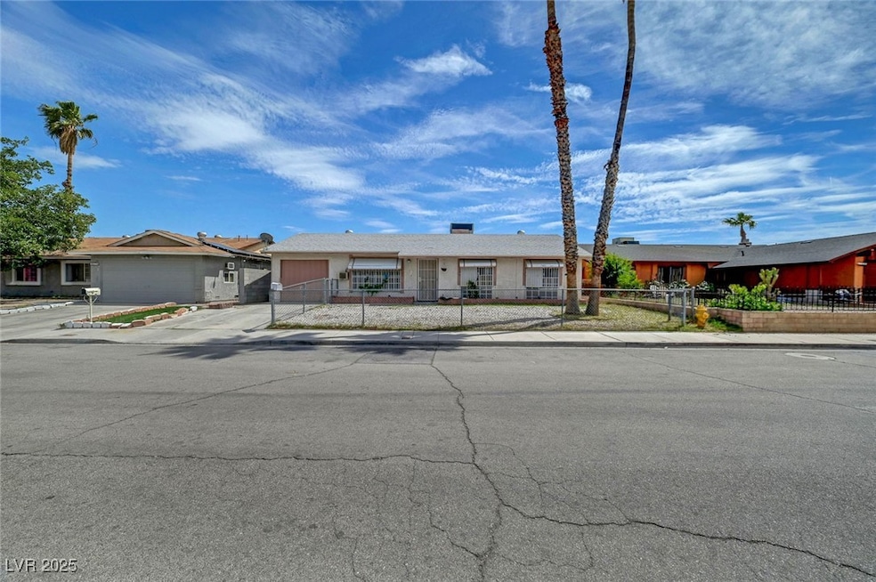 Ranch-style house featuring a fenced front yard, a