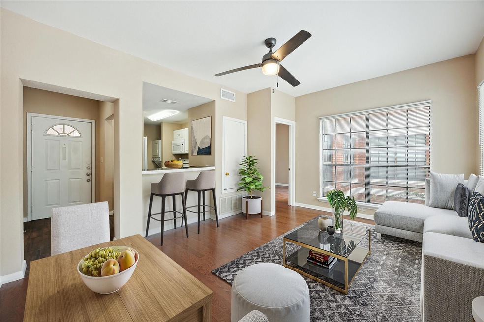 Living room with wood finished floors and ceiling