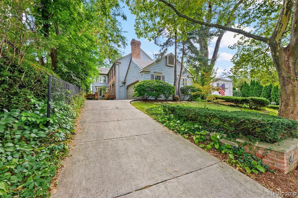 View of front facade featuring a garage and concrete driveway