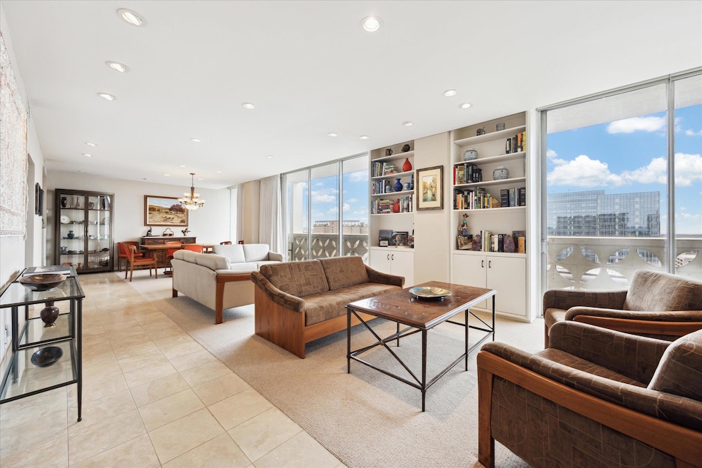 Living room with a chandelier, light tile pattern