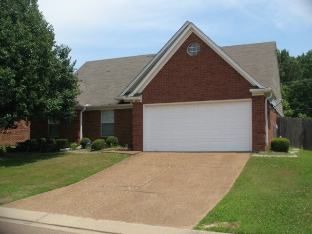 Brick one story home front entry double garage