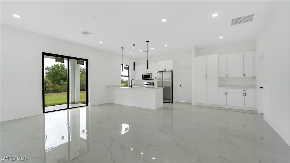 Unfurnished living room featuring recessed lightin