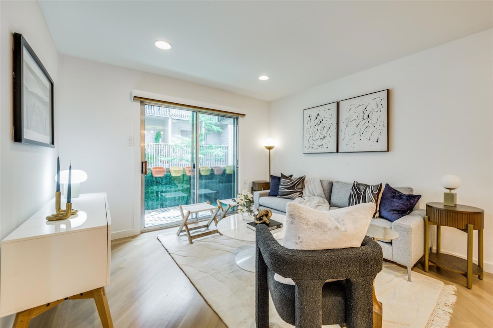 Living room with light wood-type flooring