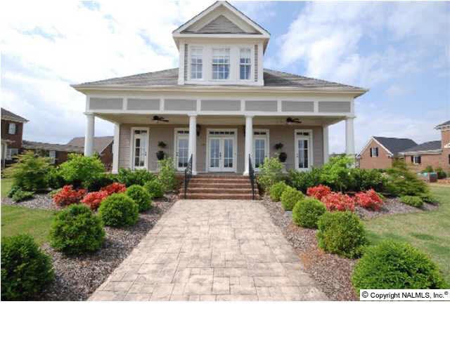 THIS ABSOLUTELY INCREDIBLE HOME IN ONE OF MADISON COUNTY'S PREMIER SUBDIVISIONS FEATURES 4500 SQUARE FEET OF LUXURY LIVING. THERE ARE 4 BEDROOMS, 6 BATHS AND THIS HOME FACES THE COMMUNITY LAKE AND HAS THE BEST VIEW IN THE SUBDIVISION. YOU ARE LOCATED ACRO