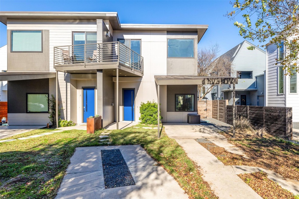 View of front of property featuring a balcony and