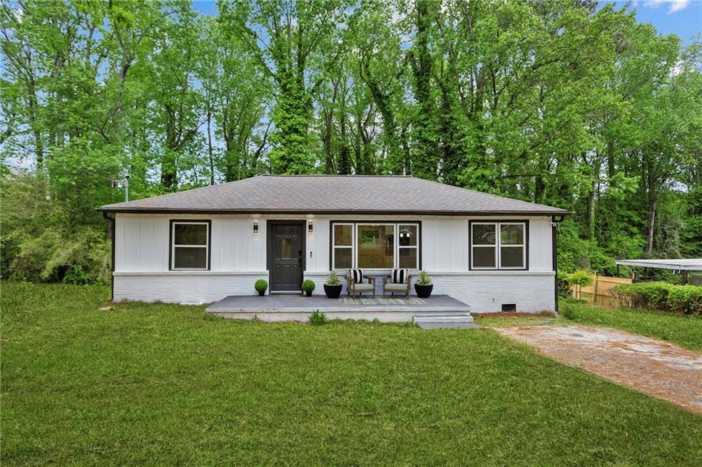 Ranch-style home featuring roof with shingles, bri