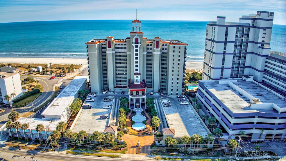 Aerial view with a water view and a beach view