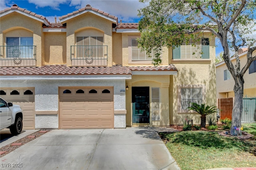 Mediterranean / spanish-style house with fence, a