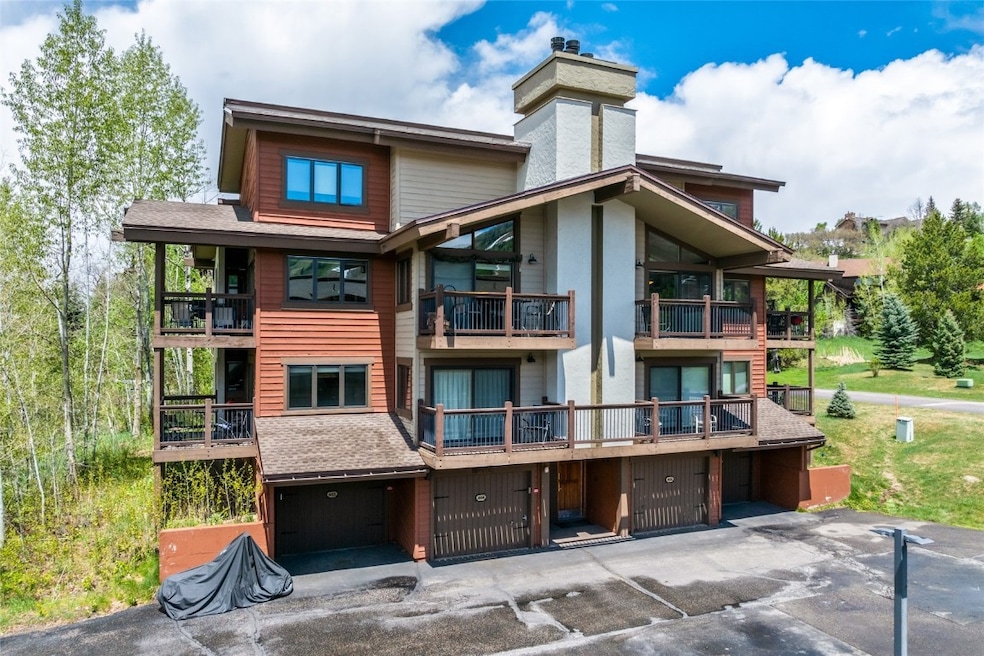 Back of property with a chimney and a balcony