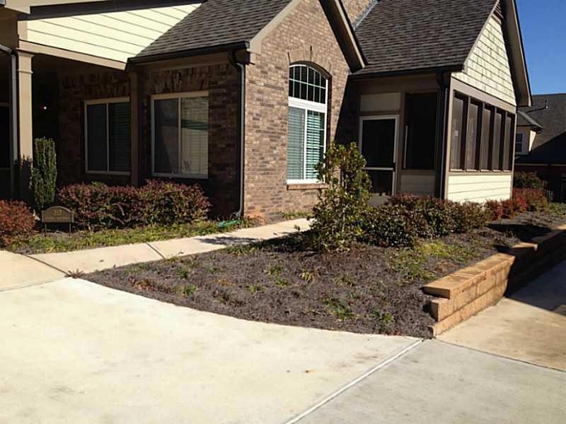 Exterior Front. 4 sides brick and stone exteriors.