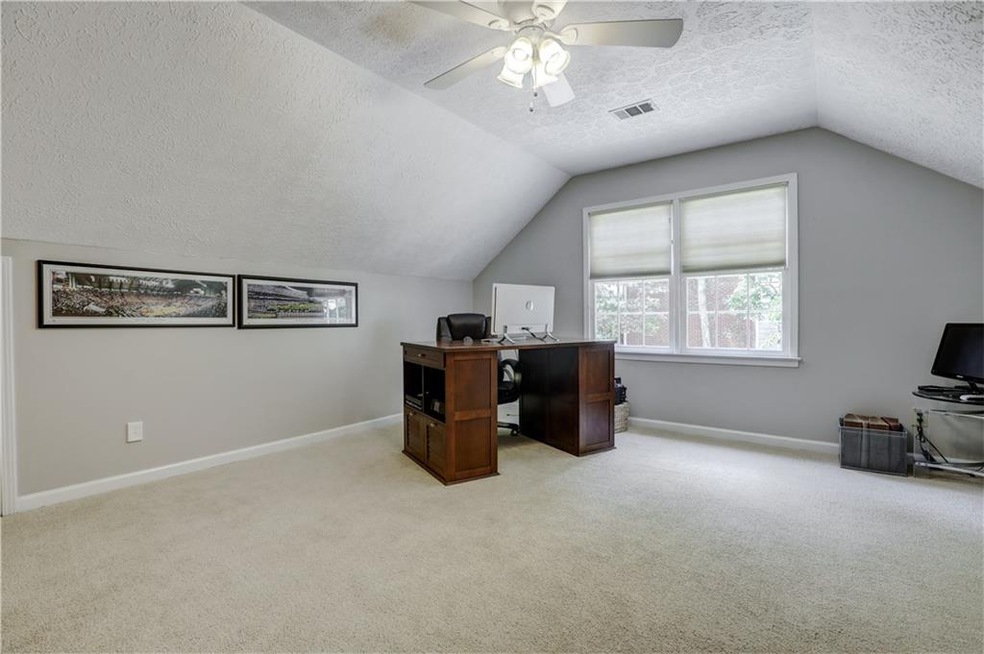 Second staircase leads to this room with a vaulted ceiling.  This could also make for a great teen room, playroom, or exercise room!