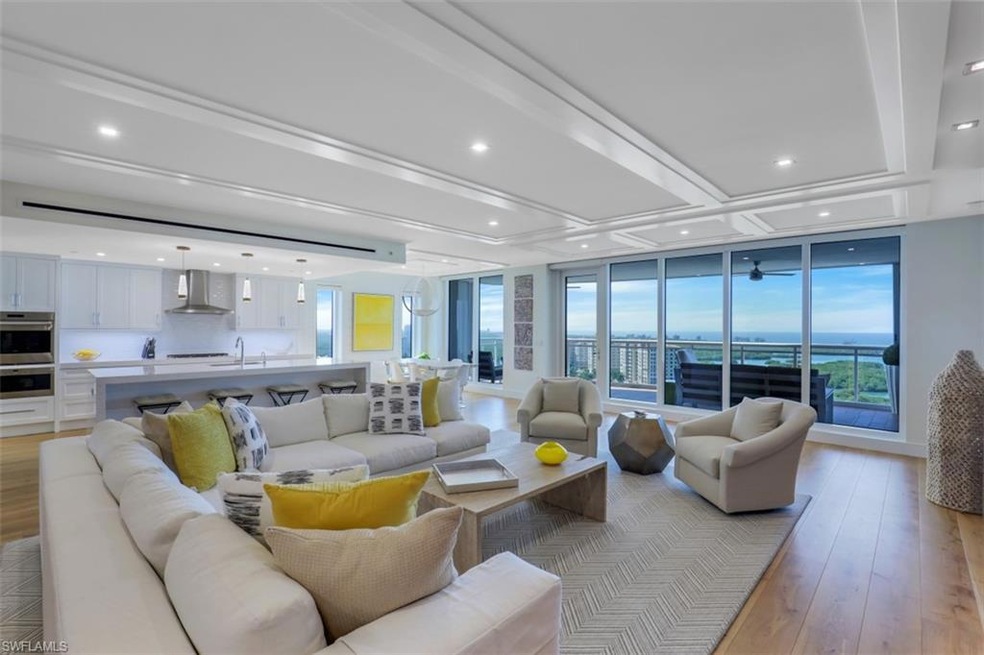 Living room featuring light wood finished floors, healthy amount of natural light, and recessed lighting