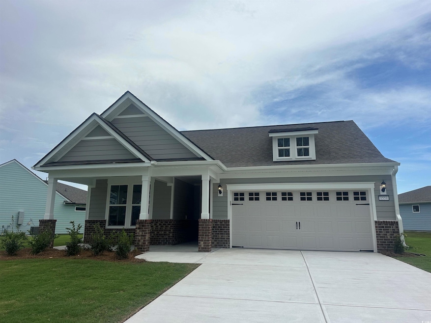 Craftsman-style house featuring a garage, a porch,