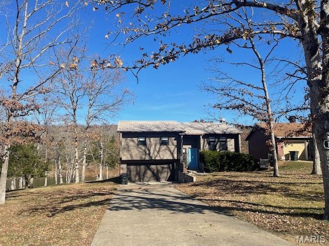 View of front of home featuring driveway and a garage