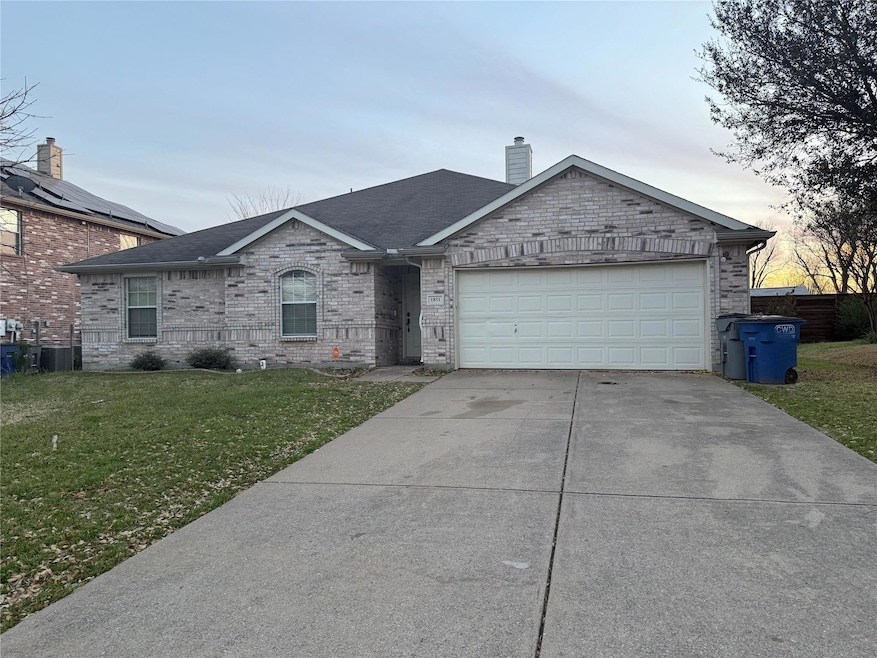 Ranch-style house featuring brick siding, a front 