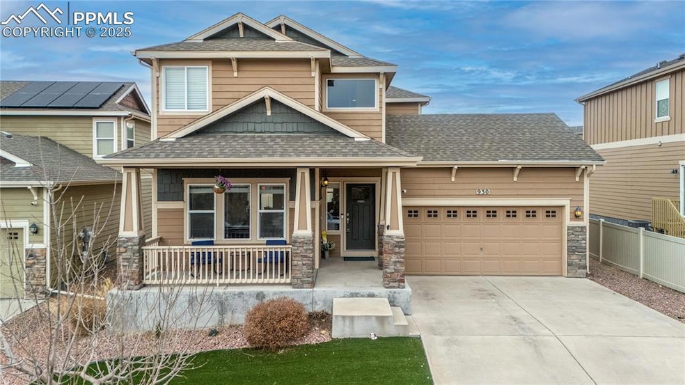 Craftsman-style house with a 2 car garage and a porch.