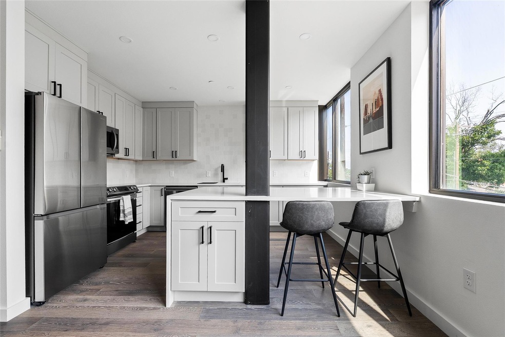 Kitchen with stainless steel appliances, a sink, 