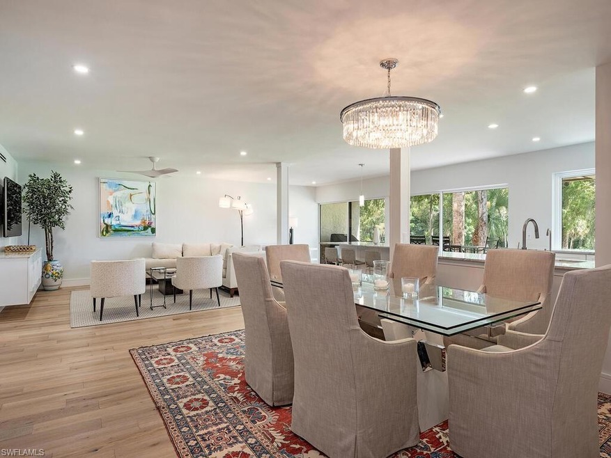 Dining area featuring an inviting chandelier and l