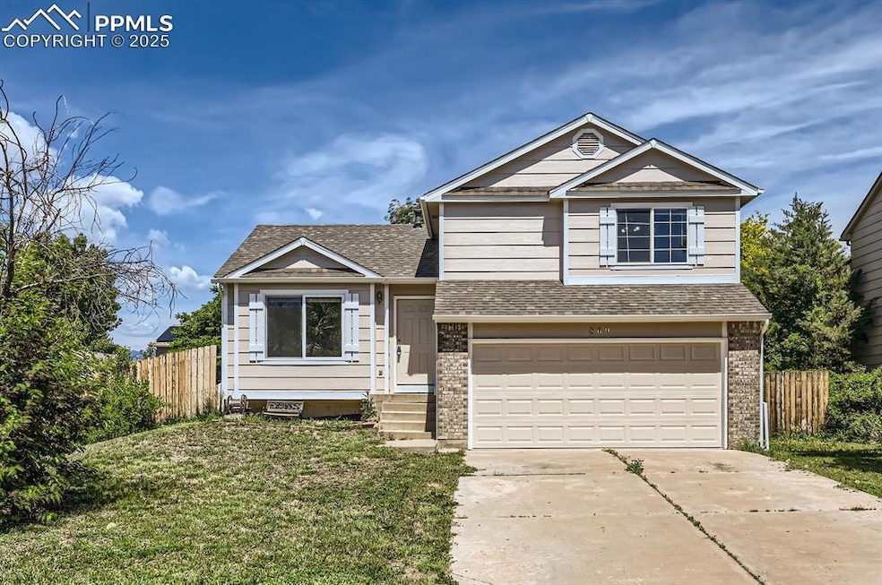 View of front of house featuring a garage, driveway, roof with shingles, and brick siding