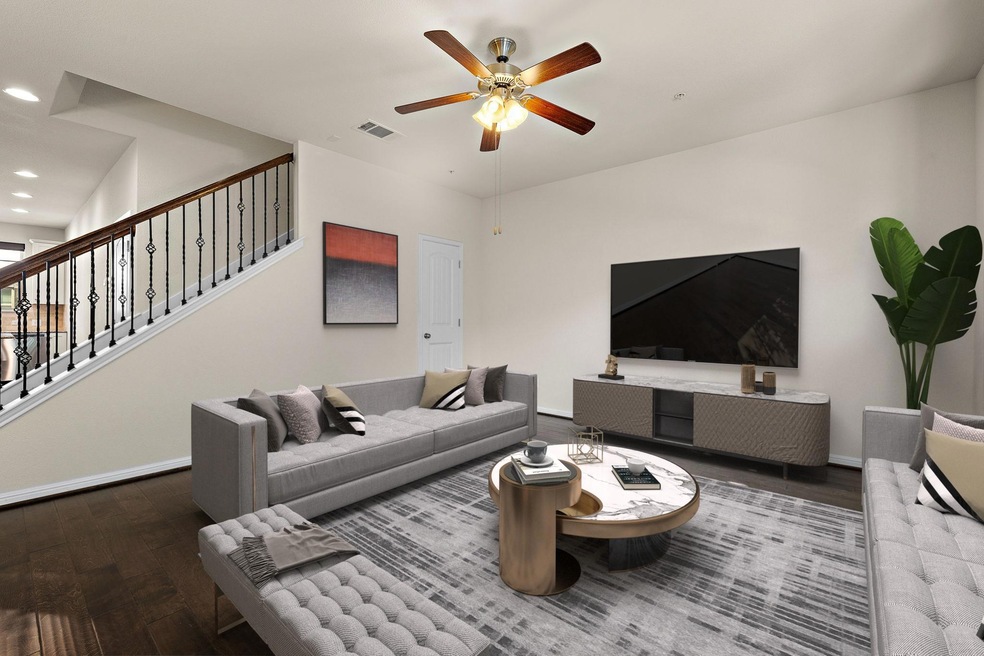 Living area featuring wood finished floors, reces