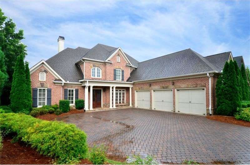 Absolutely perfect four side brick home with paver