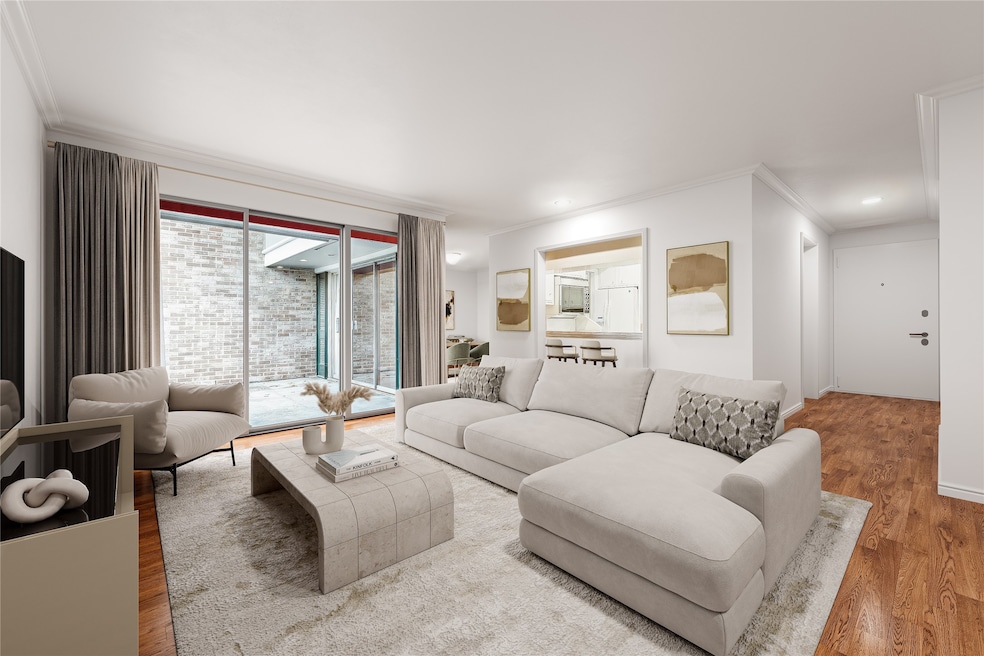 Spacious living room that overlooks a private, par