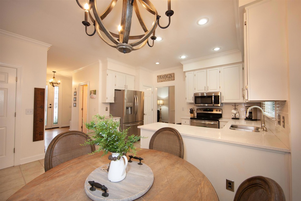Quartz countertops and white subway titles highlight this kitchen!  It's clean and bright.