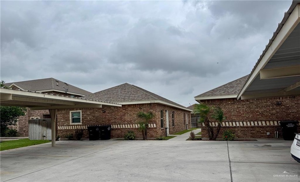 View of property exterior with fence, a shingled roof, and brick siding