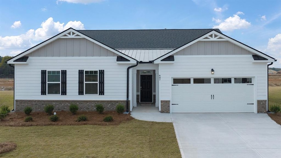 View of front of property with a front lawn and a 
