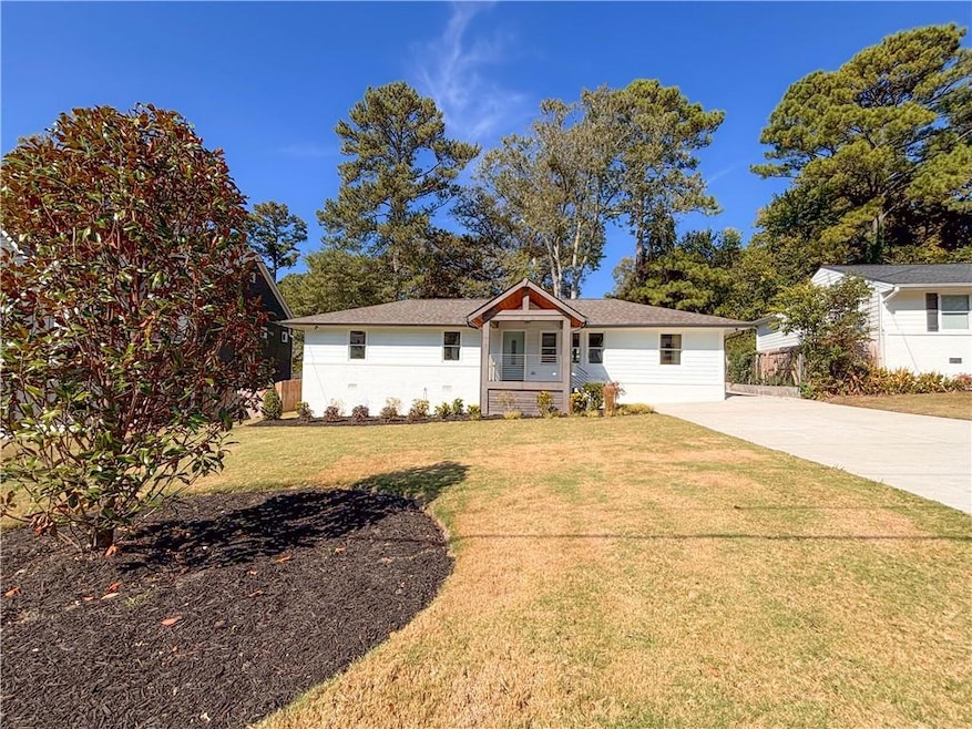 Ranch-style house with a front lawn