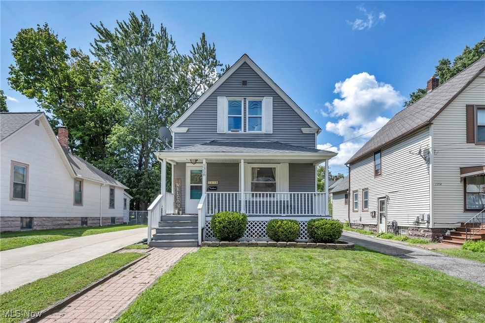 Bungalow-style home featuring a front lawn and covered porch