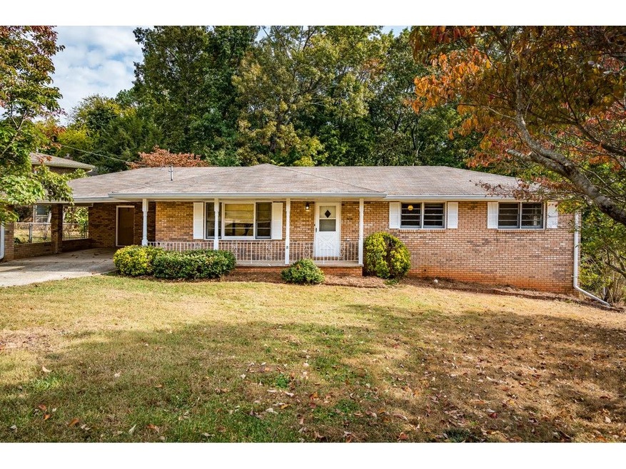 CHARMING FOUR BEDROOM BRICK HOME