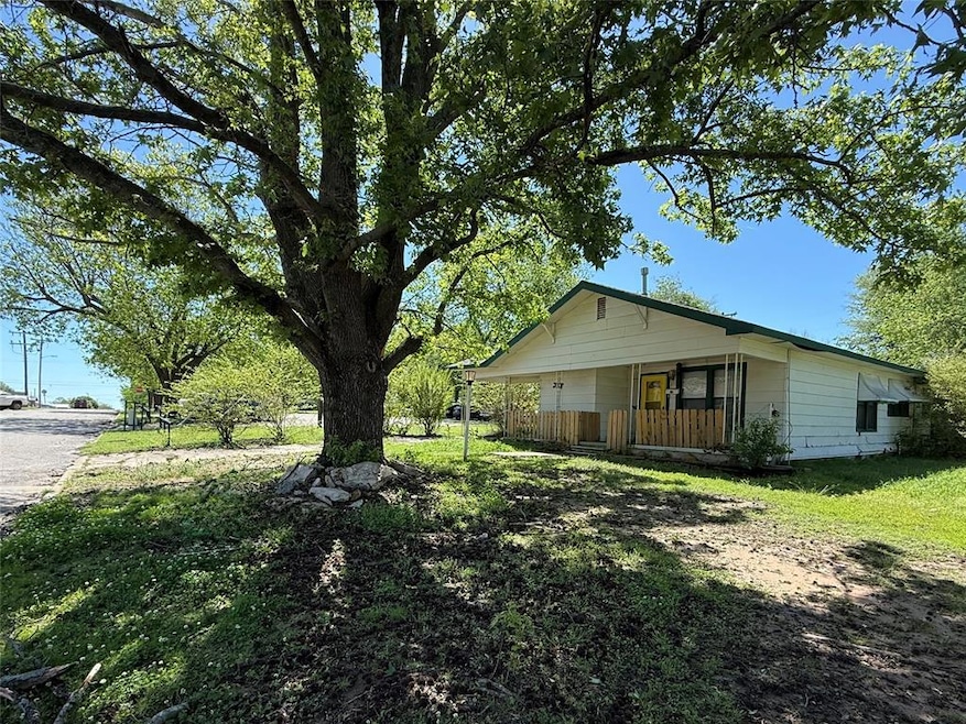 View of property exterior featuring covered porch 