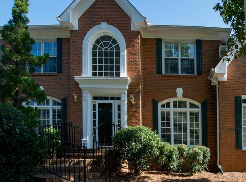 View of front of house featuring brick siding