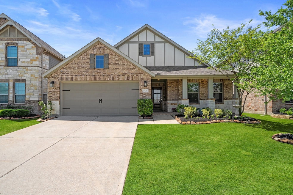 The exterior features a majestic brick and wood ra